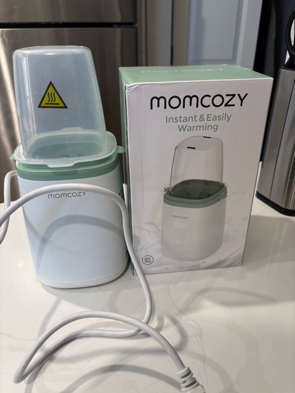 Momcozy Baby Bottle Warmer in White and Mint
